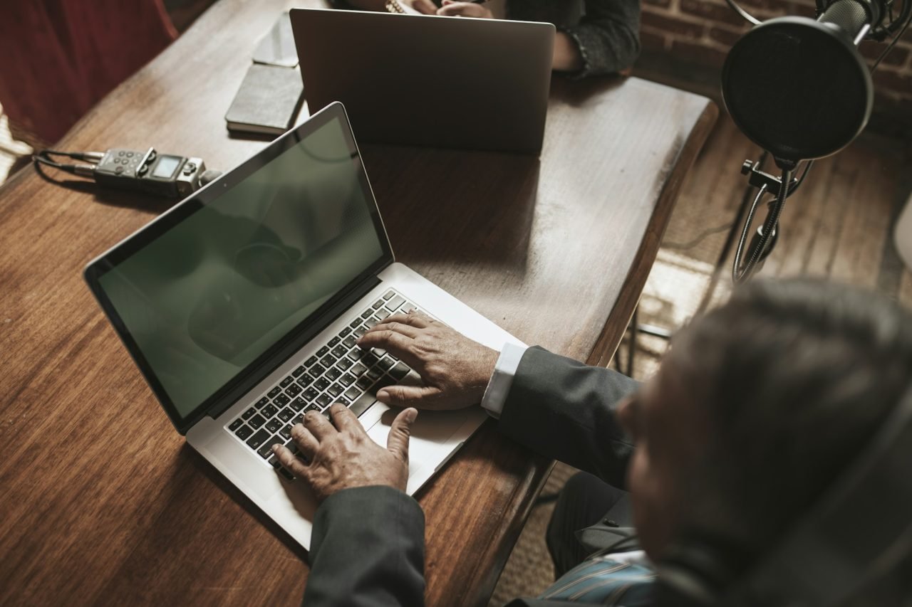 Person working on a laptop at a desk